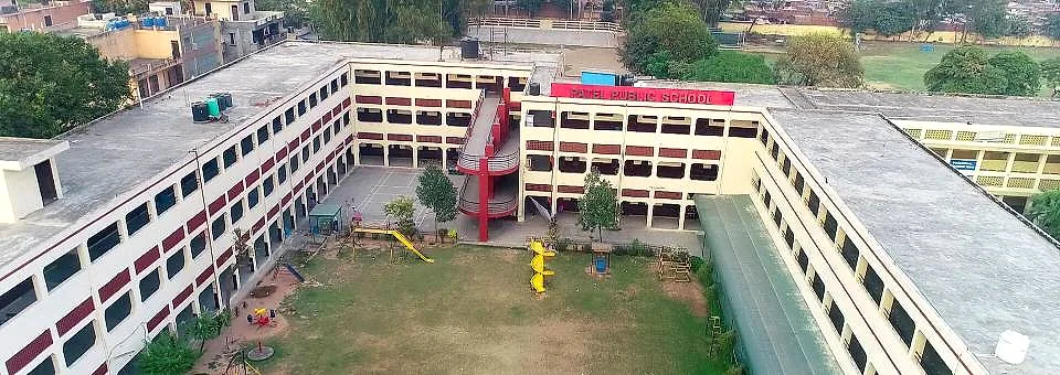 Aerial view of the Patel Public School building wrapped around its central playground